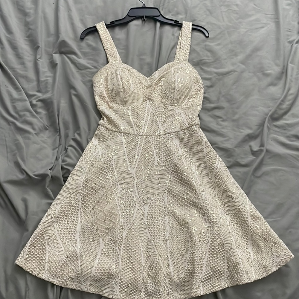 Cream, white, and gold dress